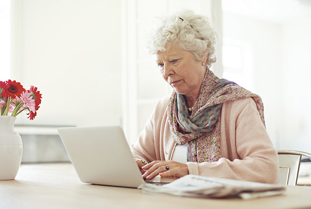 mature woman working on her computer