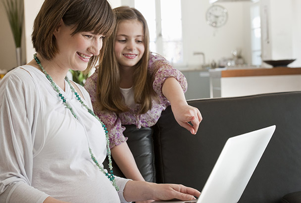 Mother and daughter using google earth.
