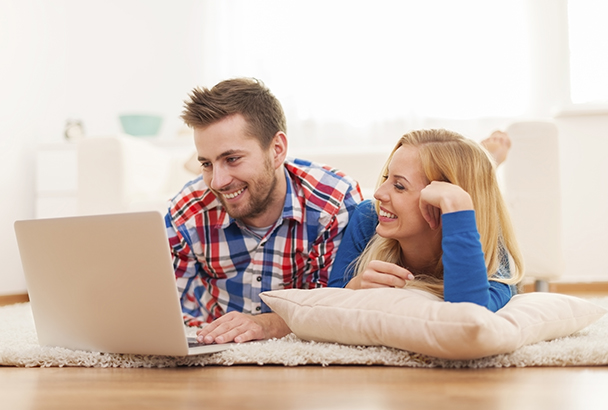 couple listening to music on computer