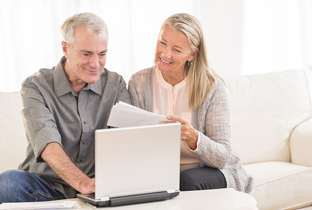 Couple booking a flight online.