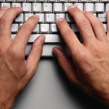 person typing on a keyboard