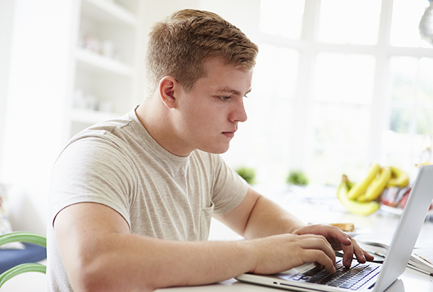Teenager looking up busroutes.