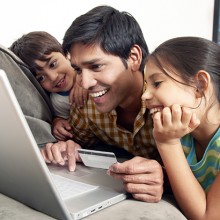 family printing off their boarding pass